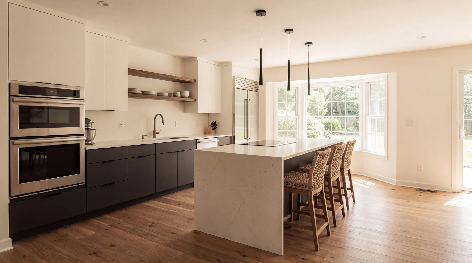 A modern kitchen with matte charcoal cabinets, a quartz waterfall island and walnut open shelving
