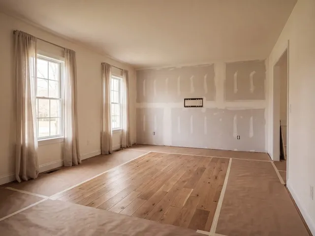 The same wall with new drywall taped and floated, ready for finish